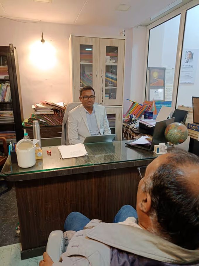 Clinic interior with bookshelf and consultation desk